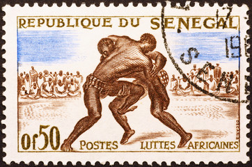 African wrestlers on old postage stamp of Senegal