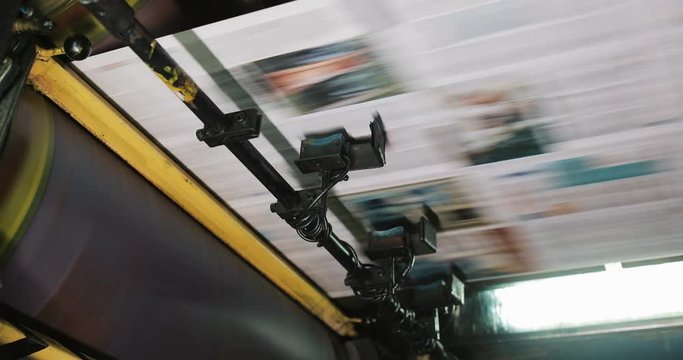 Print plant factory. Newspaper printing at a plant. Newspaper printed on a printing house machine. Close up