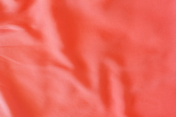 Background template textiles, fabric of living coral color. Color 2019 year concept.