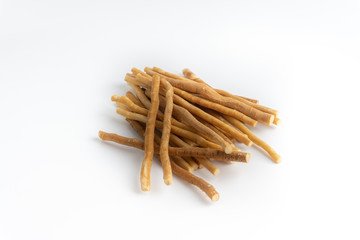 Natural toothbrush Miswak (Kayu Sugi) on white background with selective focus. It is a teeth cleaning twig made from the Salvadora persica tree and also know as miswaak, siwak, Sugi or sewak