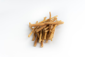 Natural toothbrush Miswak (Kayu Sugi) on white background with selective focus. It is a teeth cleaning twig made from the Salvadora persica tree and also know as miswaak, siwak, Sugi or sewak
