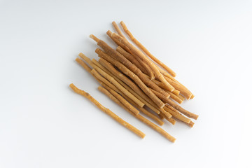 Natural toothbrush Miswak (Kayu Sugi) on white background with selective focus. It is a teeth cleaning twig made from the Salvadora persica tree and also know as miswaak, siwak, Sugi or sewak