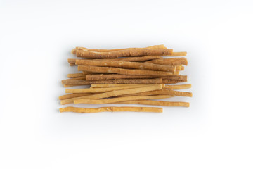 Natural toothbrush Miswak (Kayu Sugi) on white background with selective focus. It is a teeth cleaning twig made from the Salvadora persica tree and also know as miswaak, siwak, Sugi or sewak