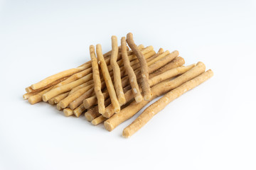 Natural toothbrush Miswak (Kayu Sugi) on white background with selective focus. It is a teeth cleaning twig made from the Salvadora persica tree and also know as miswaak, siwak, Sugi or sewak