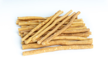 Natural toothbrush Miswak (Kayu Sugi) on white background with selective focus. It is a teeth cleaning twig made from the Salvadora persica tree and also know as miswaak, siwak, Sugi or sewak