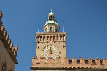 Clock In The Main Facade Of The Communal Palace In Piazza Maggiore In Bologna. Bologna Travel, holidays, architecture. March 31, 2015. Bologna, Emilia Romagna, Italy.