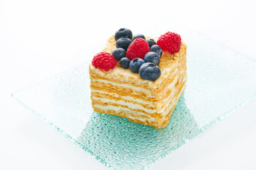 Tasty fruit cake on white background