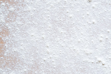 flour on the wooden board background