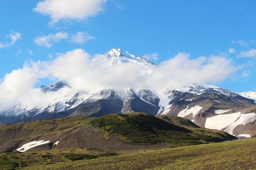 View of the Koryaksky volcano on a sunny day. Koryaksky or Koryakskaya Sopka is an active volcano on the Kamchatka Peninsula in the Russian Far East.