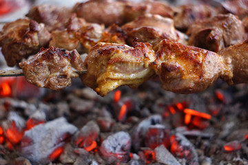 cooking meat over the coals. barbecue. closeup