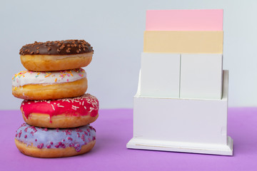 undated wooden calendar and donuts