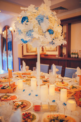 wedding decorations blue champagne bottle and wine glasses on the table with flowers