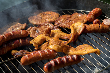 Unhealthy but tasty grilled sausages and meat