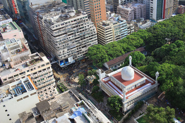 Chinese-style building and mosque tower in Kowloon