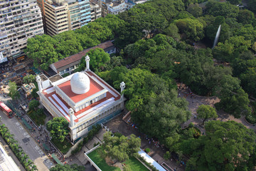 Chinese-style building and mosque tower in Kowloon