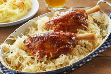Pork hocks or eisbein on shredded cabbage