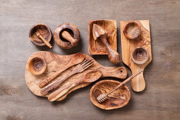 Set of wooden kitchen utensils made from olive wood . 