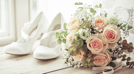 Brides shoes and wedding bouquet