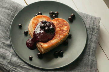 Heart-shaped pancakes with currant jam