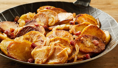 Crispy fried potatoes in a black skillet