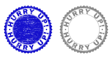 Grunge HURRY UP! stamp seals isolated on a white background. Rosette seals with grunge texture in blue and grey colors. Vector rubber stamp imitation of HURRY UP! text inside round rosette.