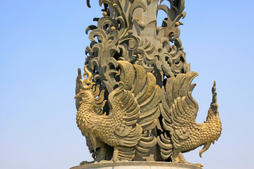 Fototapeta na wymiar phoenix sculpture in a park, tangshan city, hebei province, China