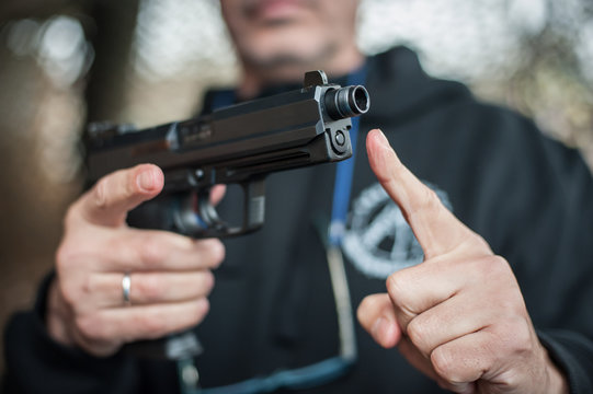 Gun Silencer. Sound suppressor reduces the sound intensity of handgun