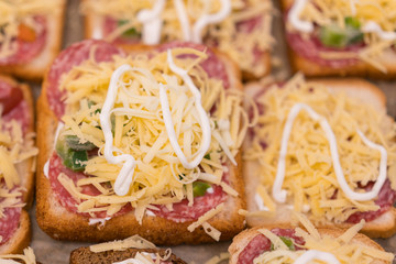 Cheese sandwiches before cooking in the oven.