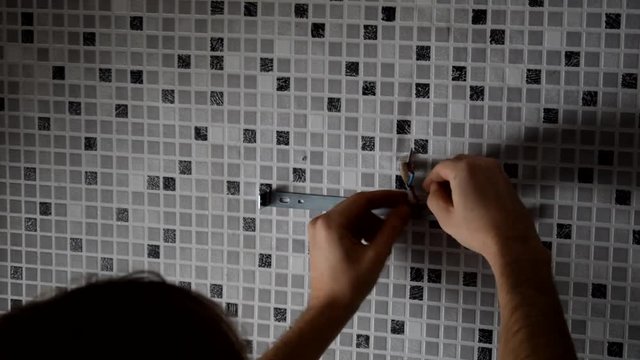Electrician replacing old wall lamp