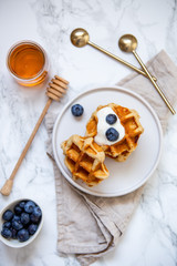 Sweet Homemade Belgian Waffle with Berry and vegan oat milk