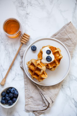 Sweet Homemade Belgian Waffle with Berry and vegan oat milk