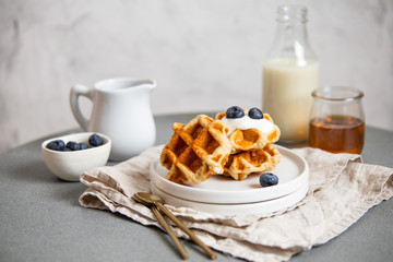 Sweet Homemade Belgian Waffle with Berry and vegan oat milk