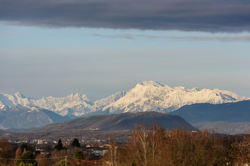 Winter panorama between Cassacco and Tricesimo. From the hills to the snow-capped mountains. Sunrise