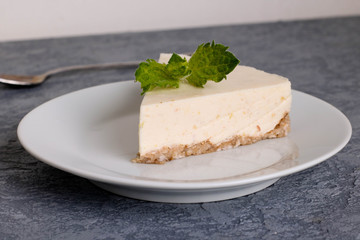 Slice of Plain New York Cheesecake on white plate
