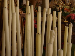 Close-up of off candles in pedestal of church in Holy Week