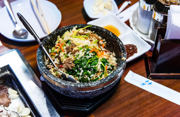 Traditional Korean bibimbap is served on the table