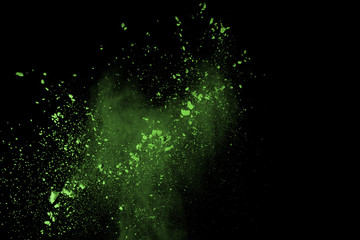 Obraz premium The movement of abstract dust explosion frozen green on black background. Stop the movement of powdered green on black background. Explosive powder green on black background.