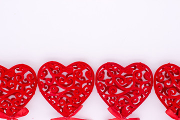 The Valentine Day Concept. Red hearts on the white background. Copy space area.