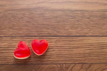 Fototapeta premium Jelly hearts on the wooden background. Valentine Day Concept.