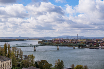 Fototapeta premium Aerial view of the Danube Band and hungarian city esztergom, slovakian city sturovo and danube river including spires of the saint ignac church