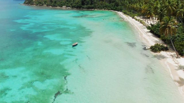 Aerial View Clear Blue Ocean Meets Tropical Island at White Sandy Beach