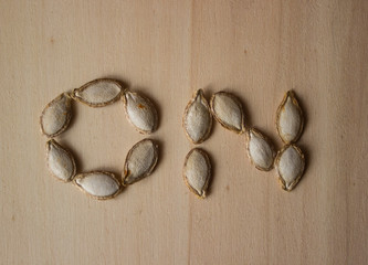 pumpkin seed word on wooden background