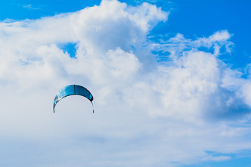 paragliding in the blue sky with clouds kiteboarding
