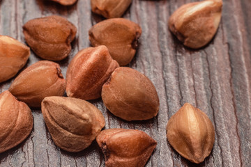 buckwheat grains on a wooden surface macro