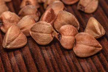 buckwheat grains on a wooden surface macro