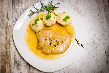 Pork with goulash - sauce and bread dumplings