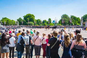 People watchng the changing of the Guard in Buckinham Palace, London, United Kingdom