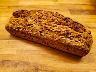 A homemade bread loaf on a wooden table