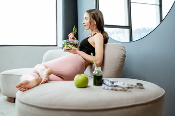 Sports woman eating healthy food