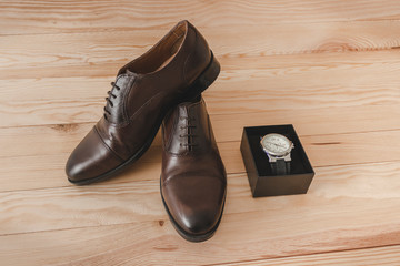 Fototapeta na wymiar Shoes and watch as accessories to dress elegantly